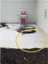 An example photo of a patio that requires mudjacking.