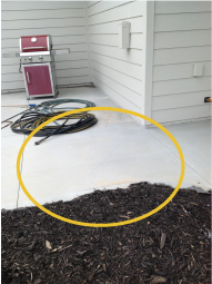 An example photo of a patio that requires mudjacking.